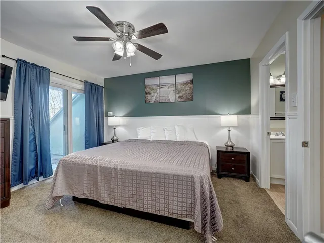 a bathroom with a sink mirror toilet and shower