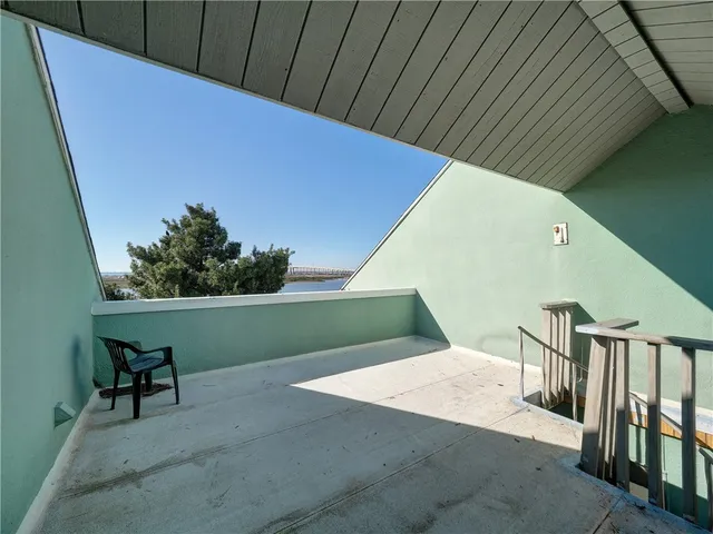 a bedroom with two beds and ceiling fan