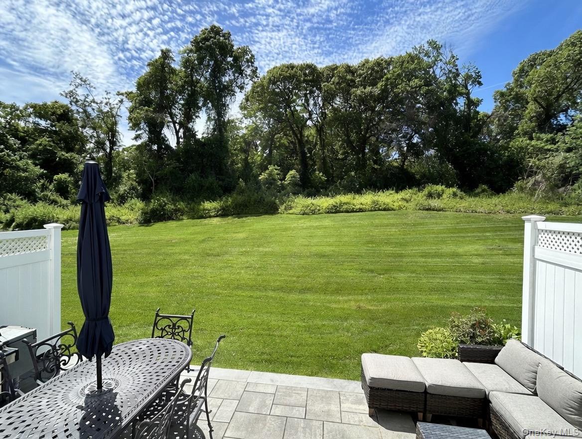 78 Hidden Ridge Drive Syosset, NY 11791 - Photo 18 of 21 a view of a patio with a yard