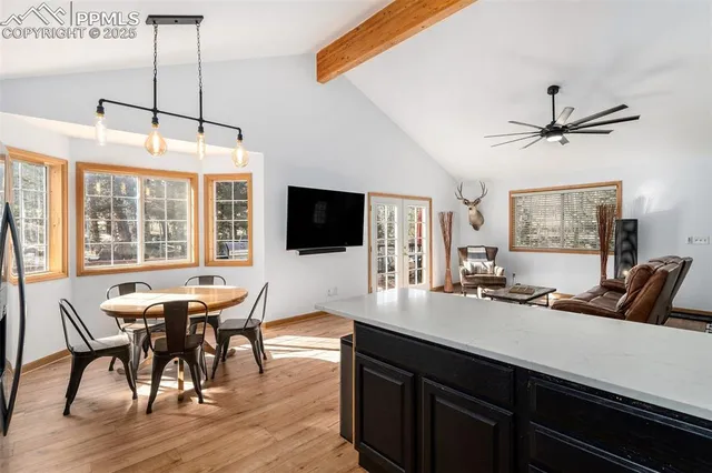 a view of a dining room with furniture window and wooden floor