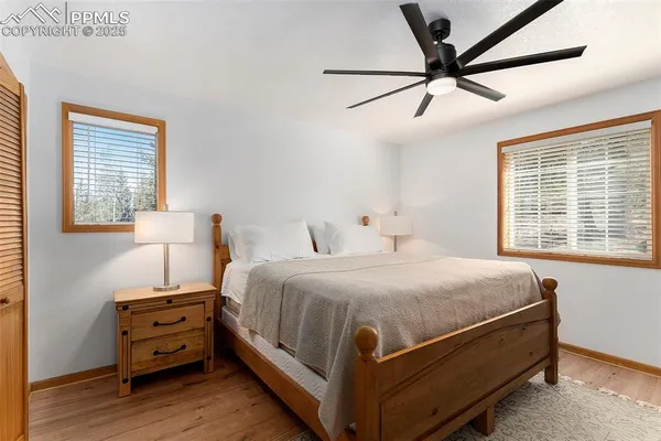 a bedroom with a bed and a tv