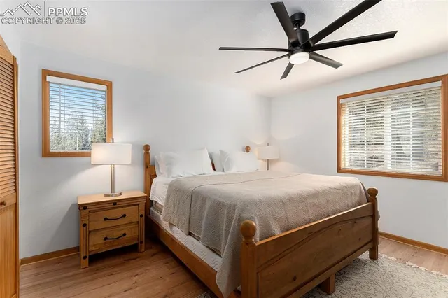 a bedroom with a bed and a tv