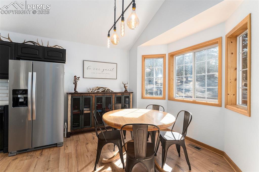 654 Piute Way Como, CO 80432 - Photo 8 of 25 a view of a dining room with furniture window and outside view