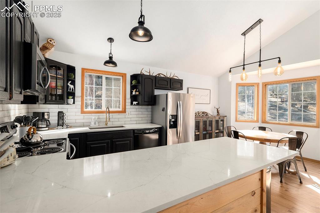 654 Piute Way Como, CO 80432 - Photo 10 of 25 a large kitchen with a table and chairs