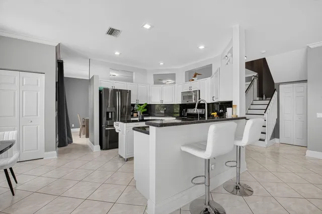 a kitchen with a sink and large window