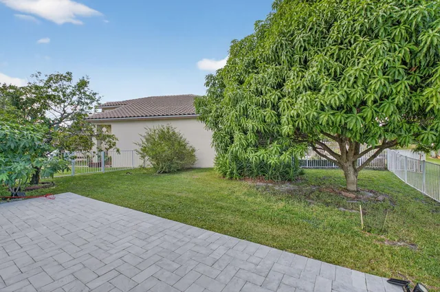 a bathroom with a double vanity sink toilet and shower