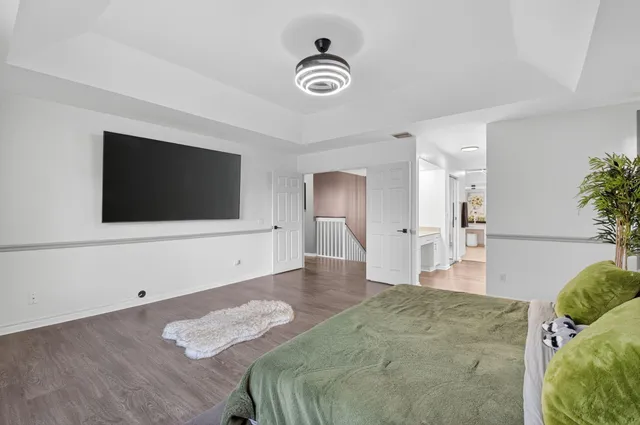 an aerial view of a houses with a swimming pool