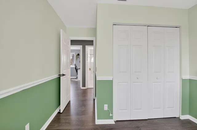 an aerial view of a house with a garden and swimming pool