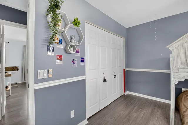 an aerial view of residential houses with outdoor space and street view