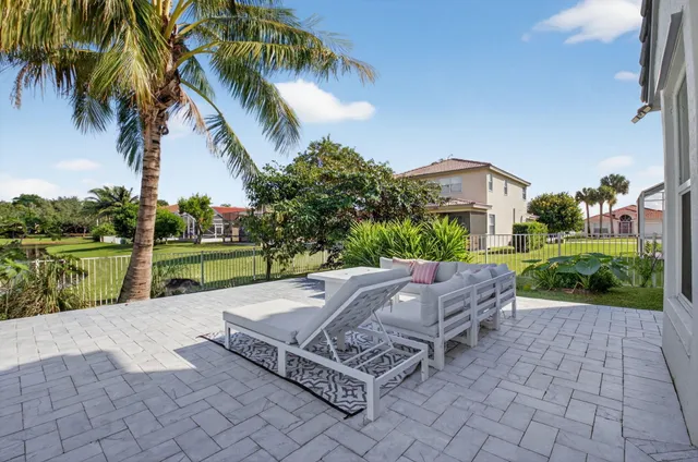 a view of a park with iron fence