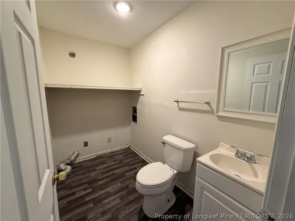 a bathroom with a toilet and a sink