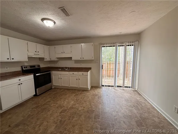 a large kitchen with a window