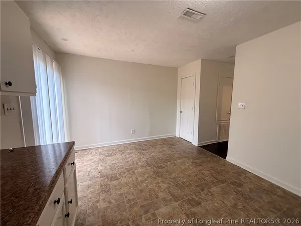 a view of a livingroom with a kitchen