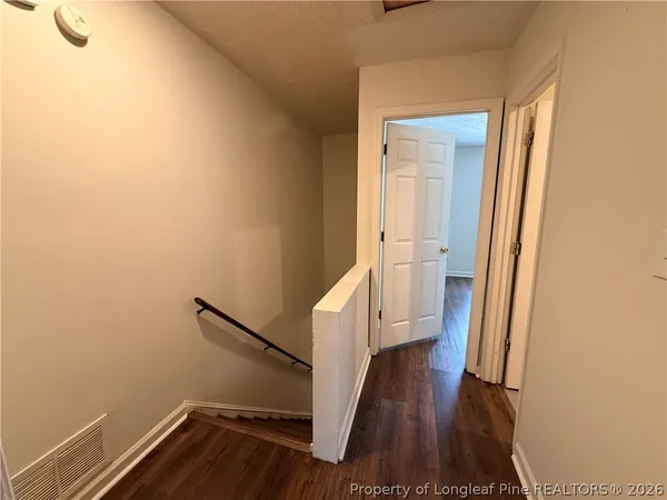 a view of entryway with wooden floor