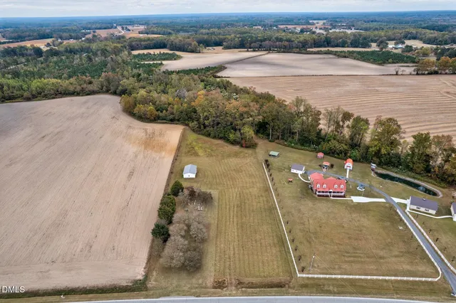 an aerial view of a house with a yard lake view and mountain view