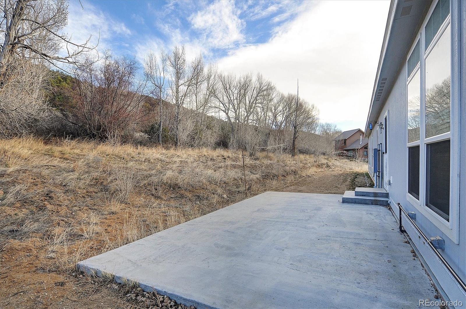 16554 Rocky Mountain Road Salida, CO 81201 - Photo 29 of 33 a view of a dry yard with trees