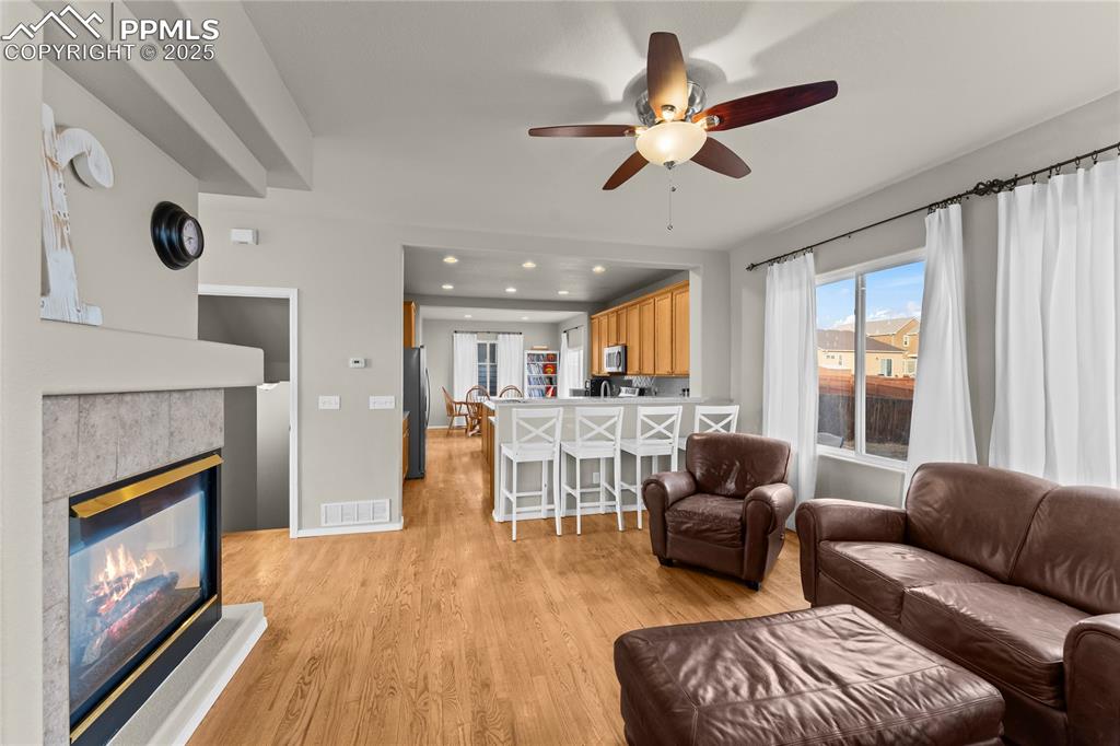 10173 Angeles Road Peyton, CO 80831 - Photo 11 of 50 a living room with furniture and a fireplace