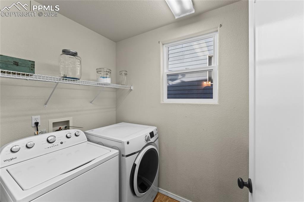 10173 Angeles Road Peyton, CO 80831 - Photo 19 of 50 a view of storage and utility room with washer and dryer