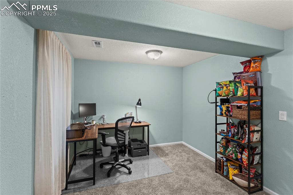 10173 Angeles Road Peyton, CO 80831 - Photo 38 of 50 a view of a workspace with furniture