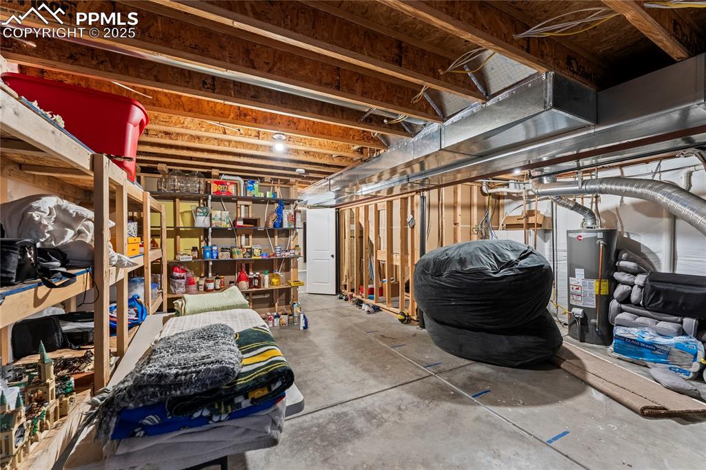 10173 Angeles Road Peyton, CO 80831 - Photo 41 of 50 a car and bike in garage