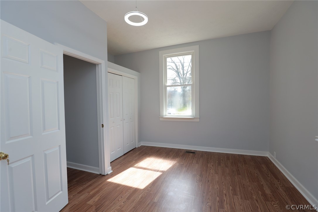 166 Wright Avenue Colonial Heights, VA 23834 - Photo 27 of 50 an empty room with wooden floor and windows