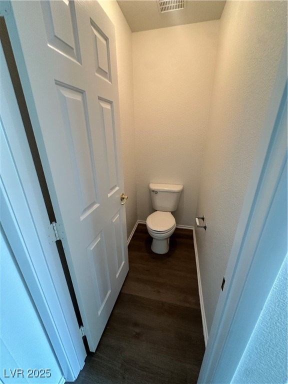 63 Puerto Azul Trail Henderson, NV 89074 - Photo 17 of 26 Bathroom featuring dark wood-style flooring and baseboards