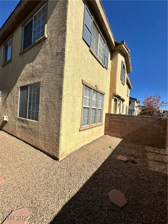 63 Puerto Azul Trail Henderson, NV 89074 - Photo 26 of 26 View of side of property with stucco siding
