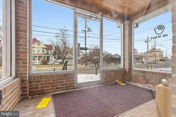 a view of a street with a large window