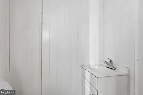 a room with a window and a sink