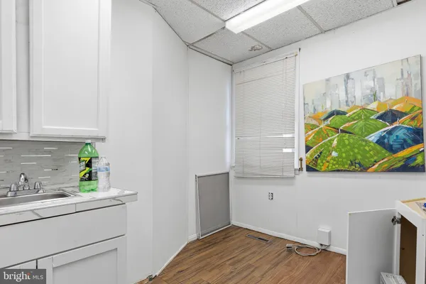 a bathroom with a sink and mirror