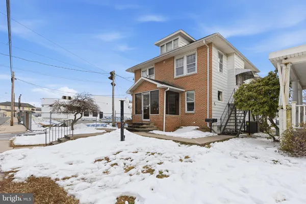 a view of a bedroom with a bed and a fireplace