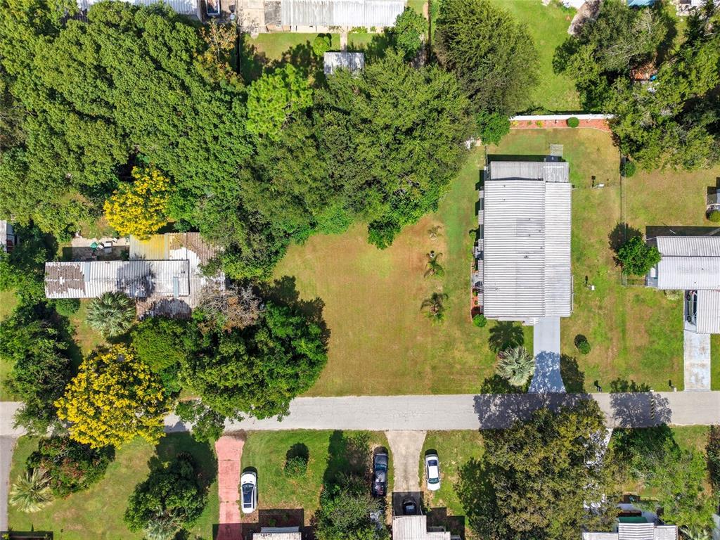 2999 Southwest 90th Place Ocala, FL 34476 - Photo 6 of 13 an aerial view of a house with a yard swimming pool and outdoor seating