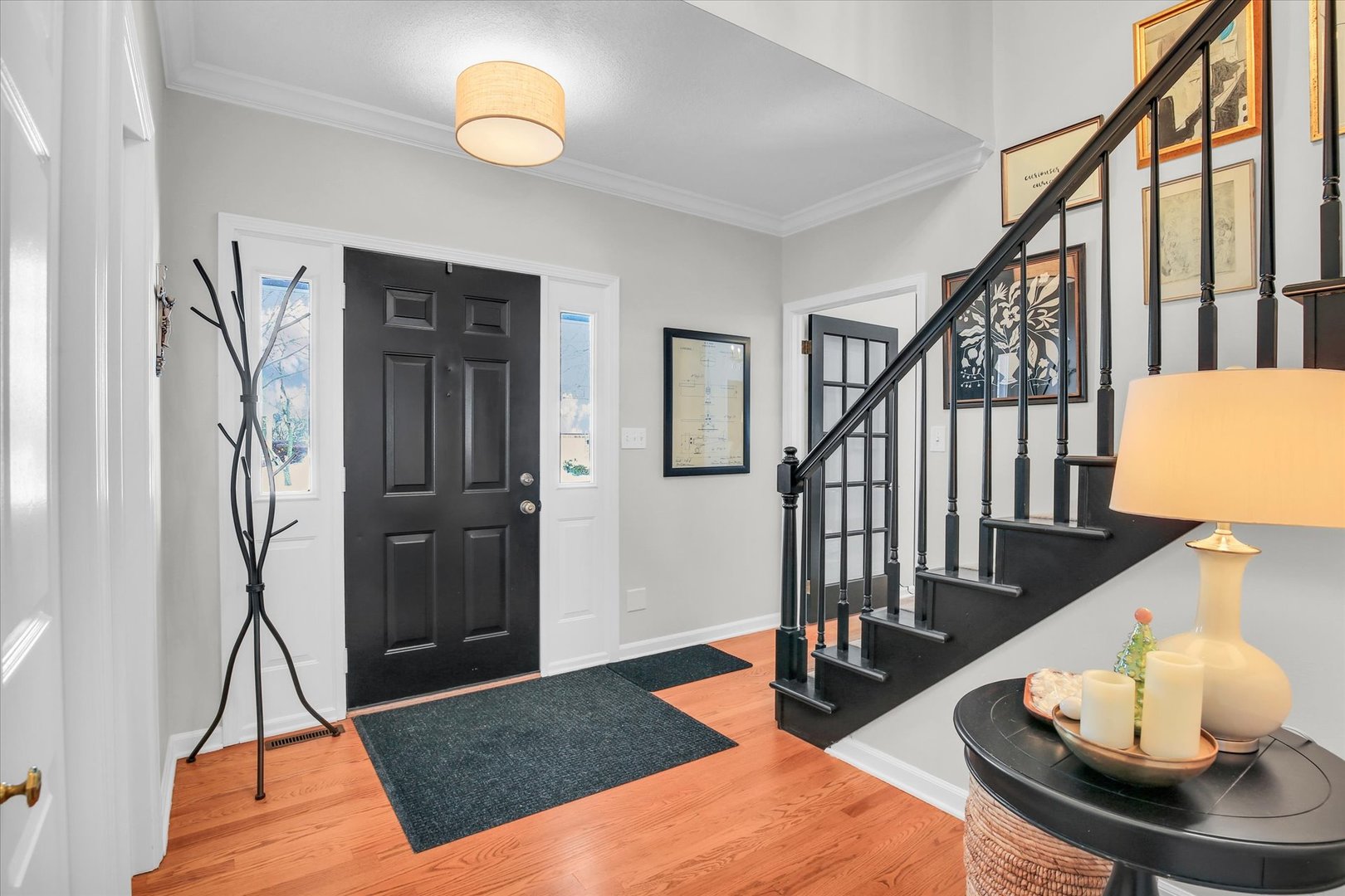 2205 Edgewater Place Champaign, IL 61822 - Photo 12 of 71 a living room with wooden floor and a rug
