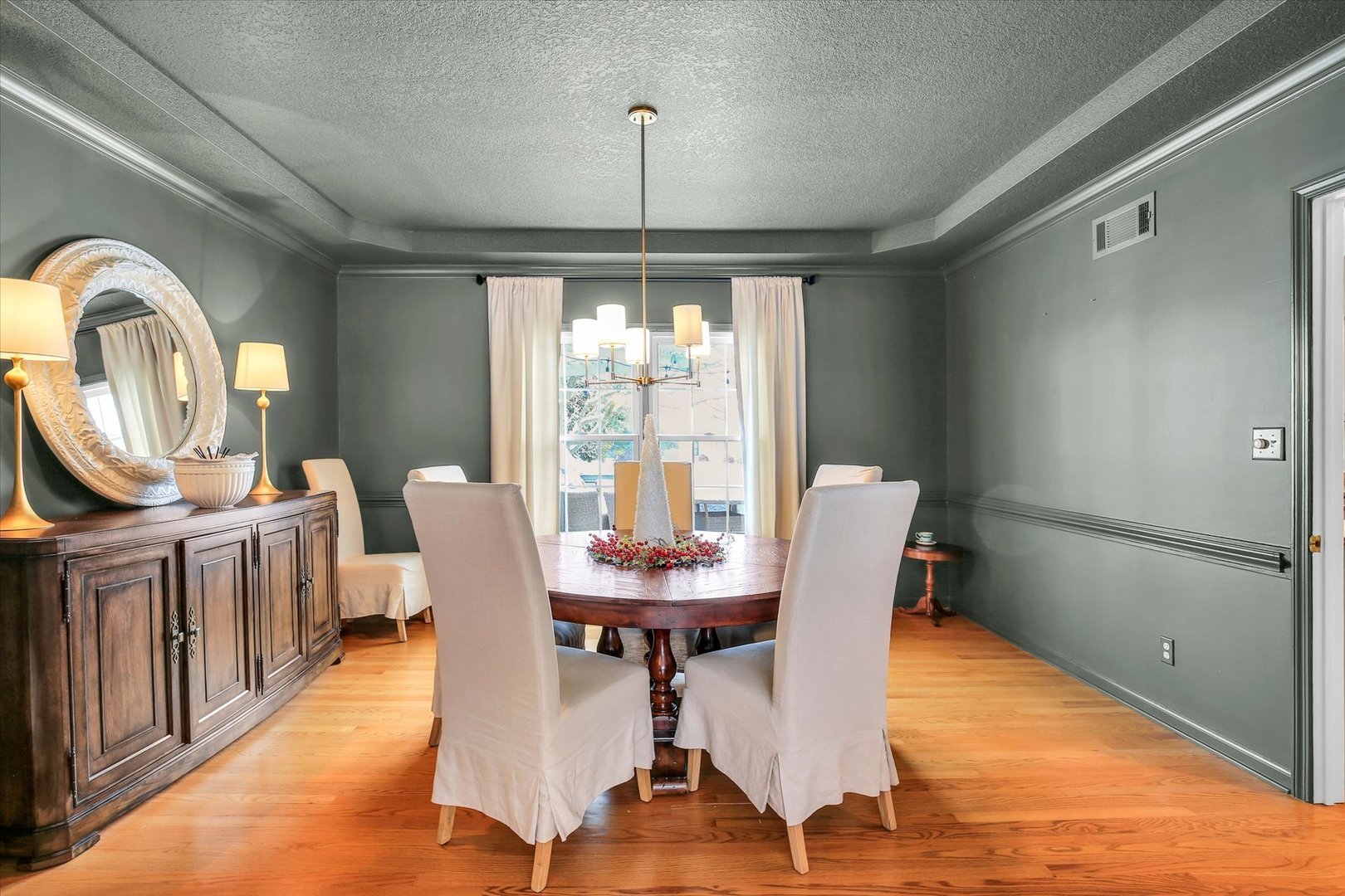 2205 Edgewater Place Champaign, IL 61822 - Photo 16 of 71 a dining room with furniture a chandelier and wooden floor