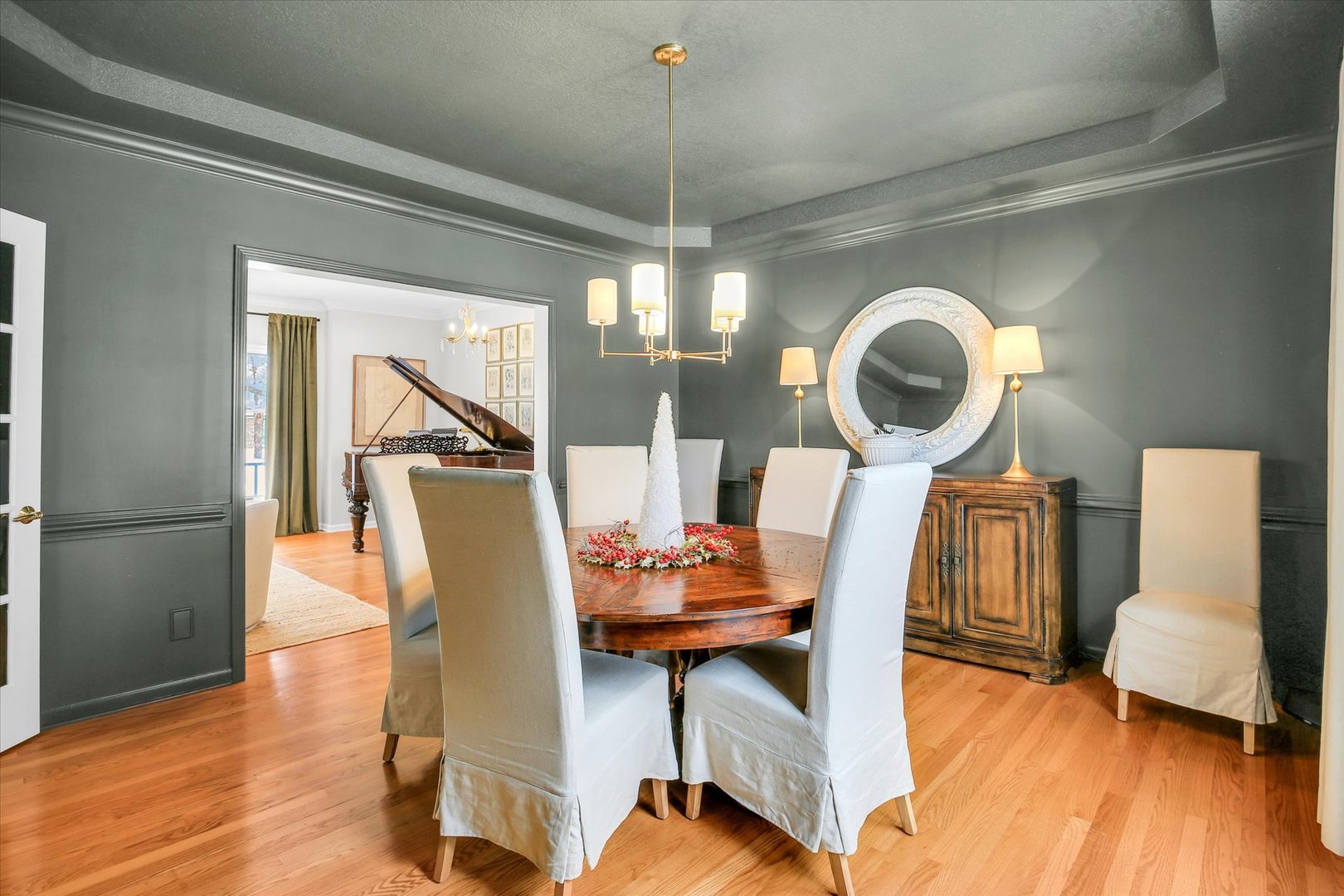 2205 Edgewater Place Champaign, IL 61822 - Photo 17 of 71 a dining room with furniture a chandelier and wooden floor