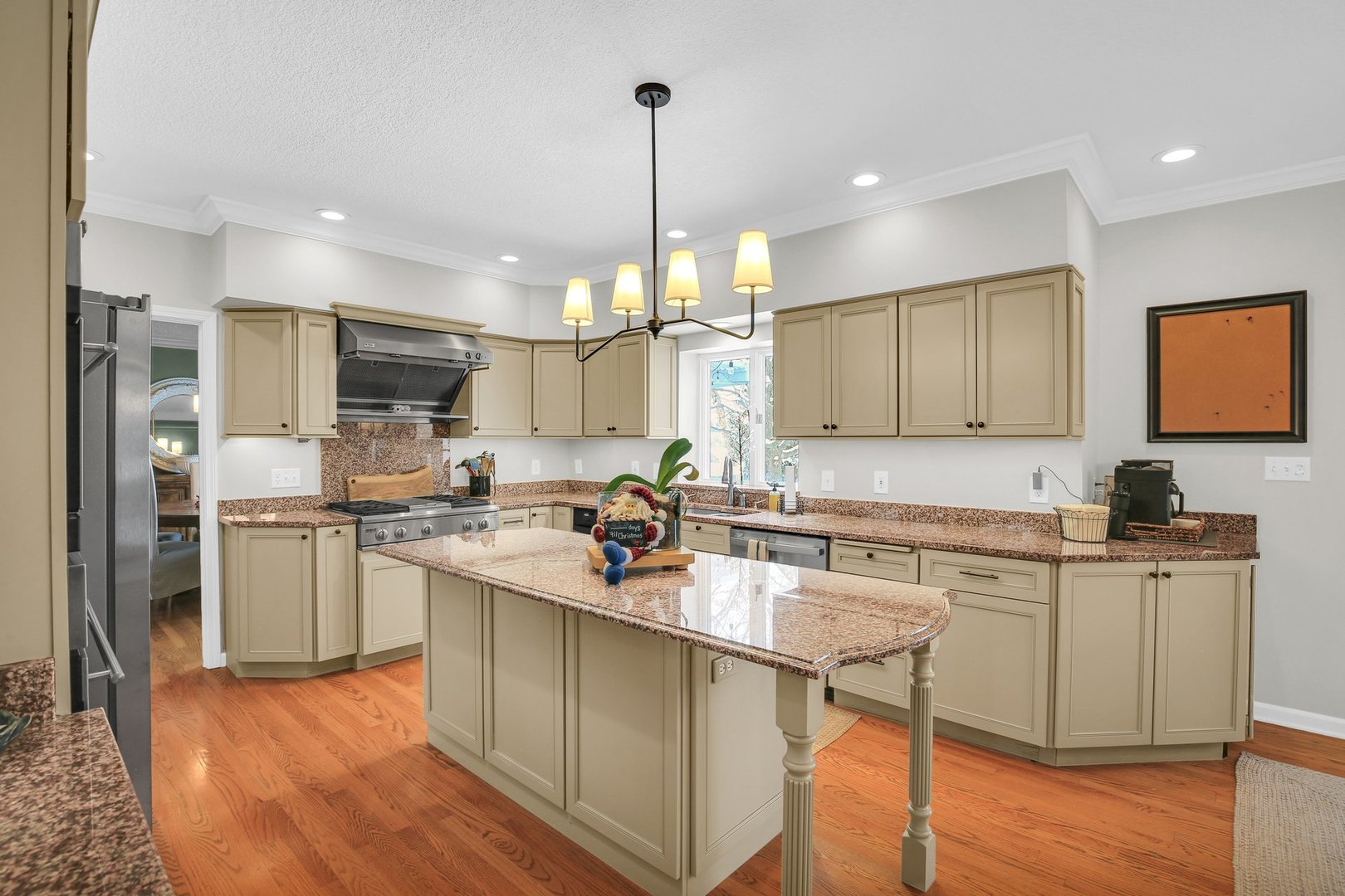 2205 Edgewater Place Champaign, IL 61822 - Photo 19 of 71 a kitchen with a sink cabinets and wooden floor