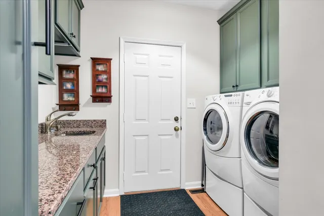 a view of staircase and hall with wooden floor
