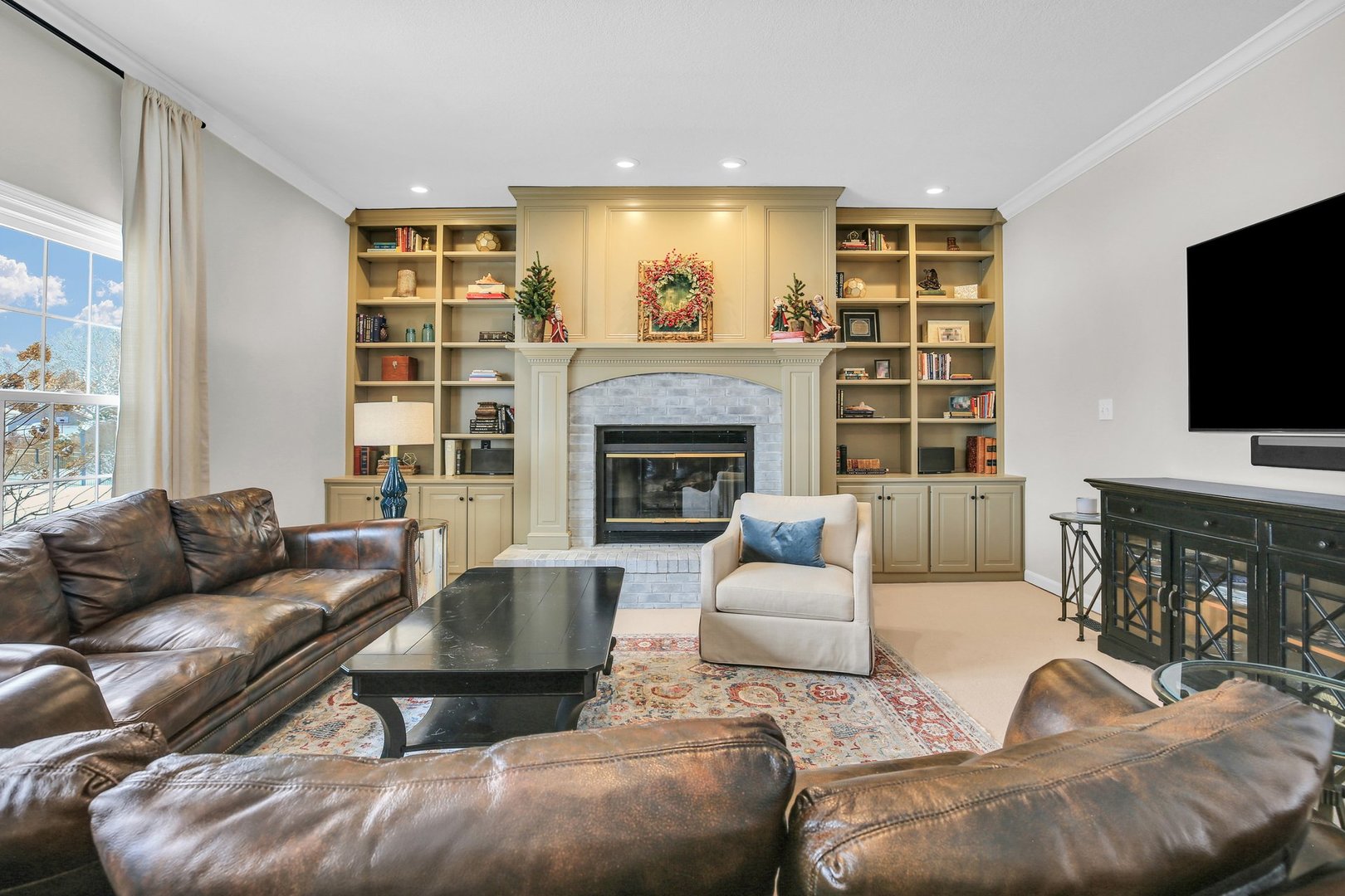 2205 Edgewater Place Champaign, IL 61822 - Photo 28 of 71 a living room with furniture and a flat screen tv