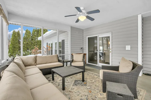 a bedroom with a bed couch and window