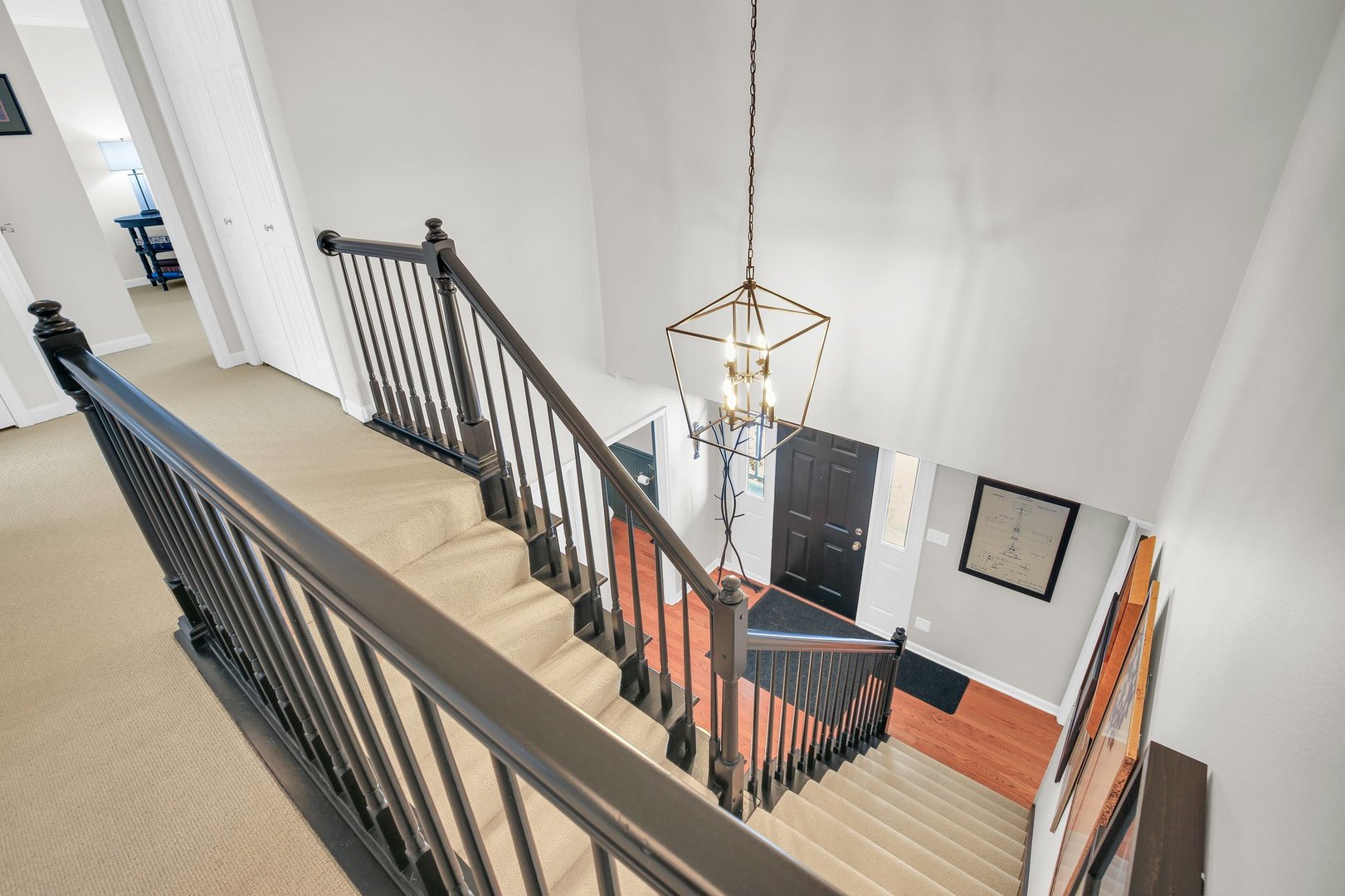 2205 Edgewater Place Champaign, IL 61822 - Photo 34 of 71 a view of staircase and hall with wooden floor