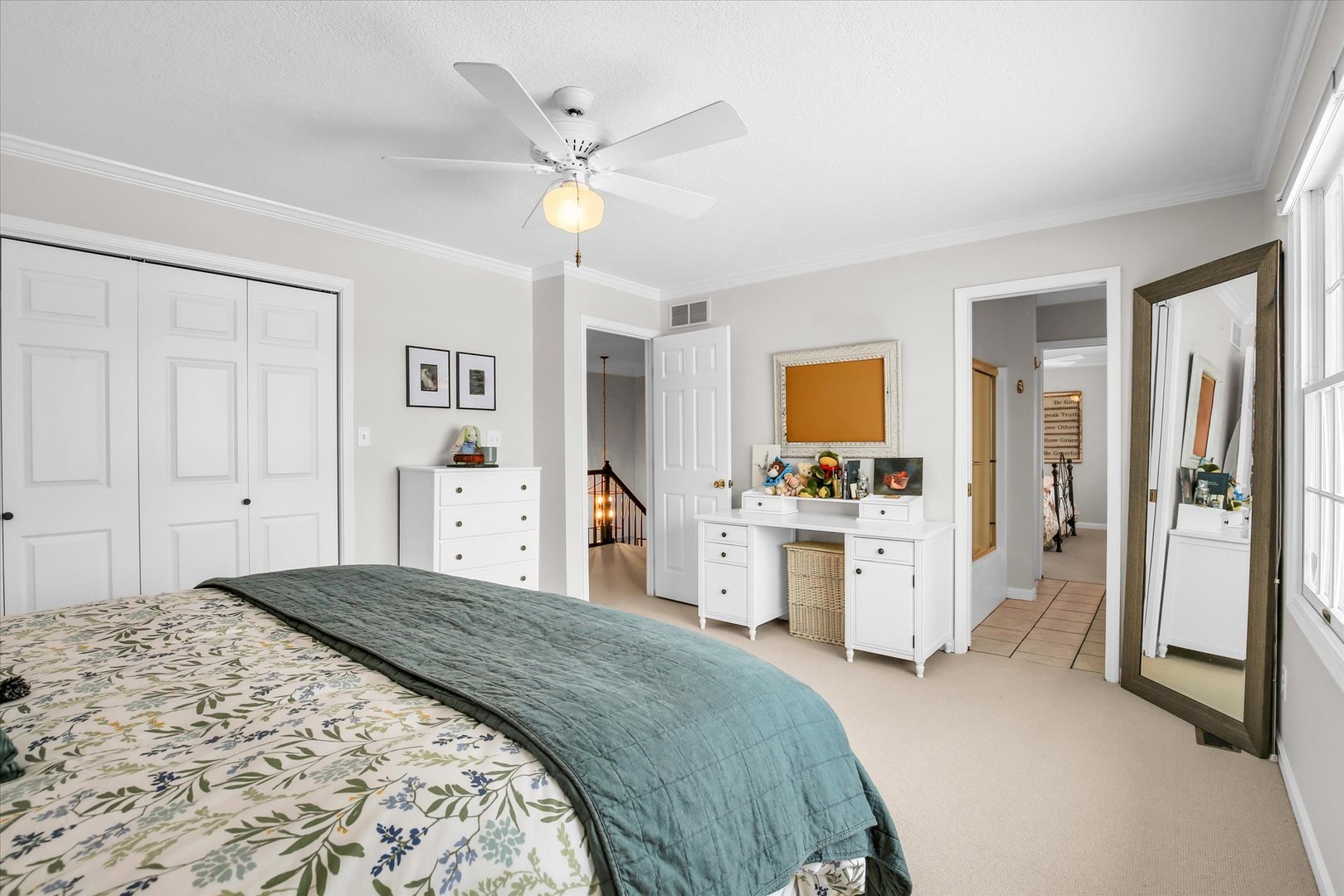 2205 Edgewater Place Champaign, IL 61822 - Photo 45 of 71 a spacious bedroom with a large bed a chandelier and closet