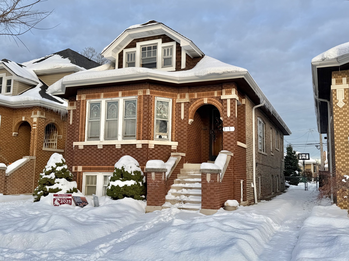 1917 Home Avenue Berwyn, IL 60402 - Photo 1 of 13 a front view of a house with patio