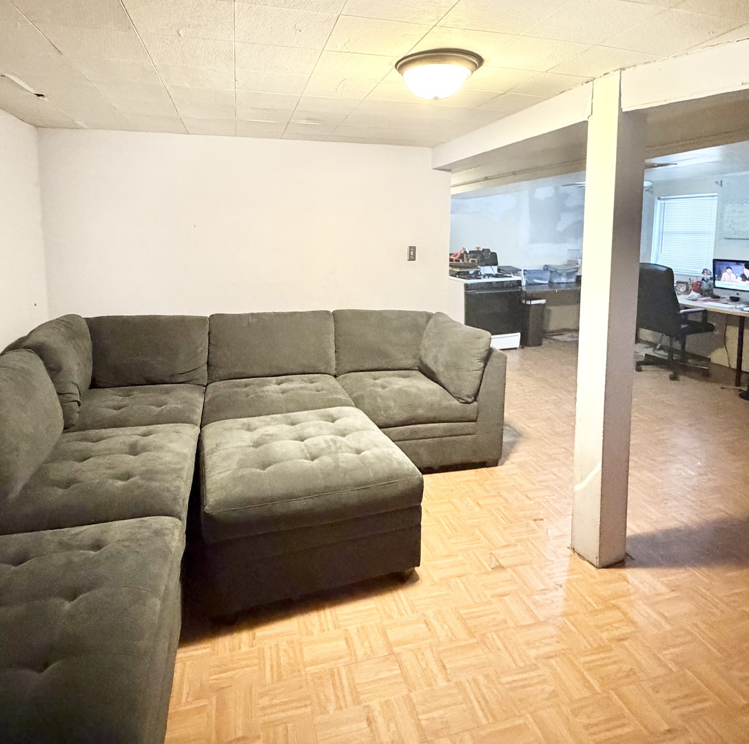 1917 Home Avenue Berwyn, IL 60402 - Photo 8 of 13 a living room with a couch and a view of living room
