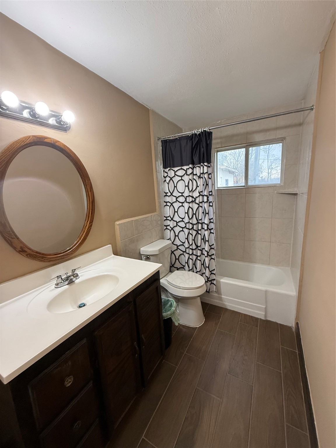 11216 Rusty Street Houston, TX 77093 - Photo 13 of 18 a bathroom with a toilet sink and mirror