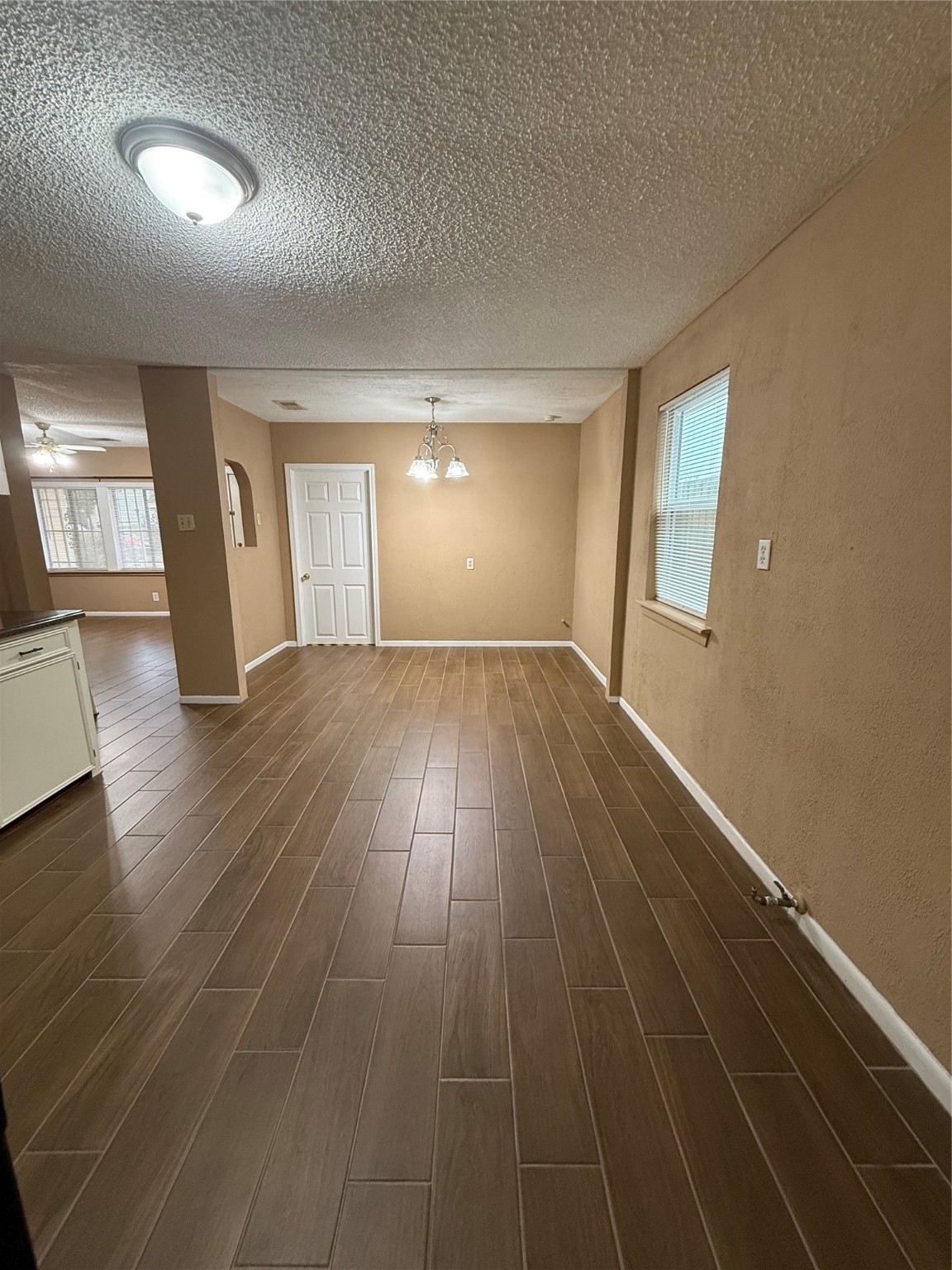 11216 Rusty Street Houston, TX 77093 - Photo 17 of 18 an empty room with wooden floor and windows