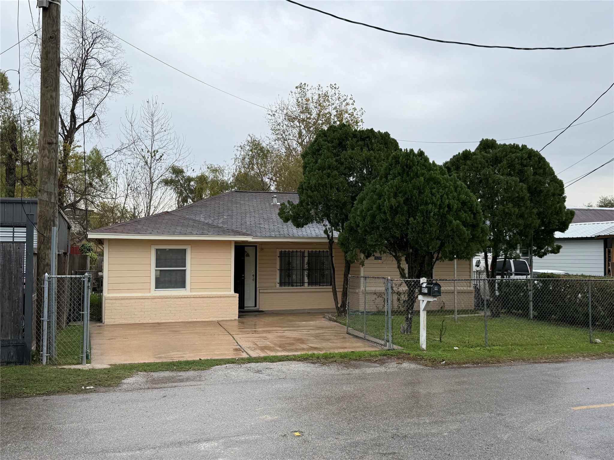11216 Rusty Street Houston, TX 77093 - Photo 2 of 18 a front view of a house with a yard and garage