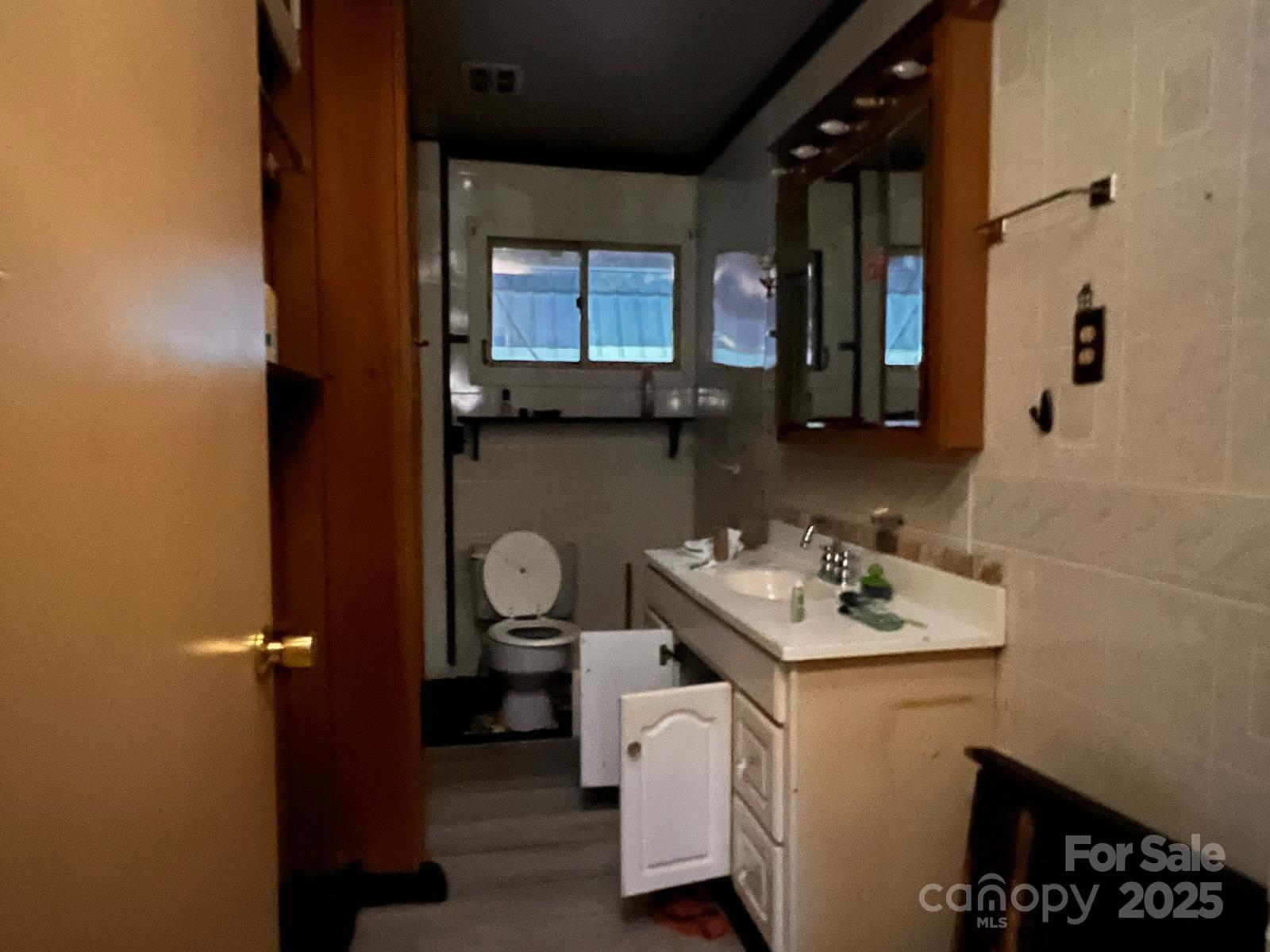 1371 Wing Road Bakersville, NC 28705 - Photo 2 of 6 a utility room with sink dryer and washer