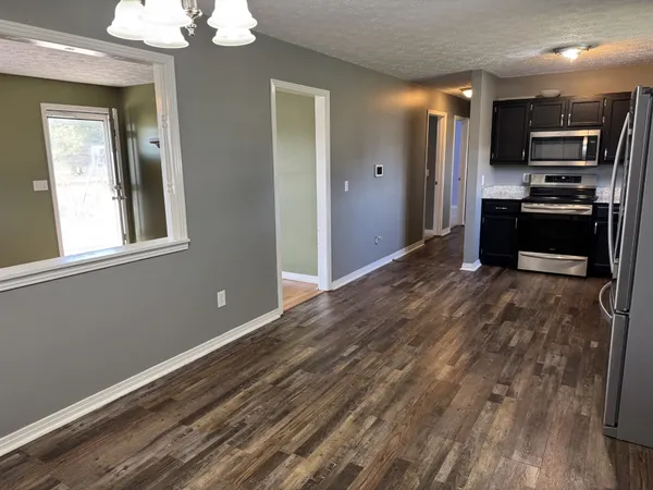 a kitchen with a stove and a microwave