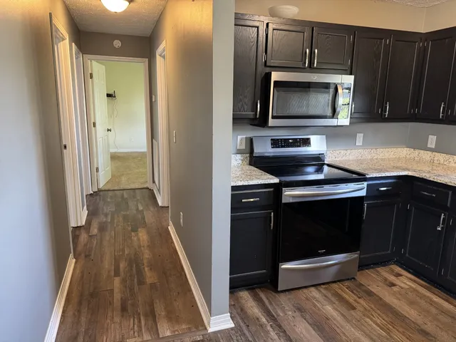 a view of roof with wooden floor