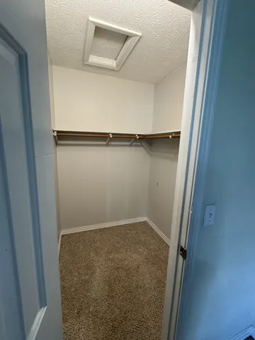 a view of a balcony with wooden floor and lake view